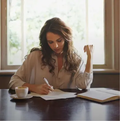 Woman writing at desk